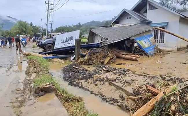 At least 26 dead and 11 missing after flash floods and landslides on Indonesia's Sumatra island